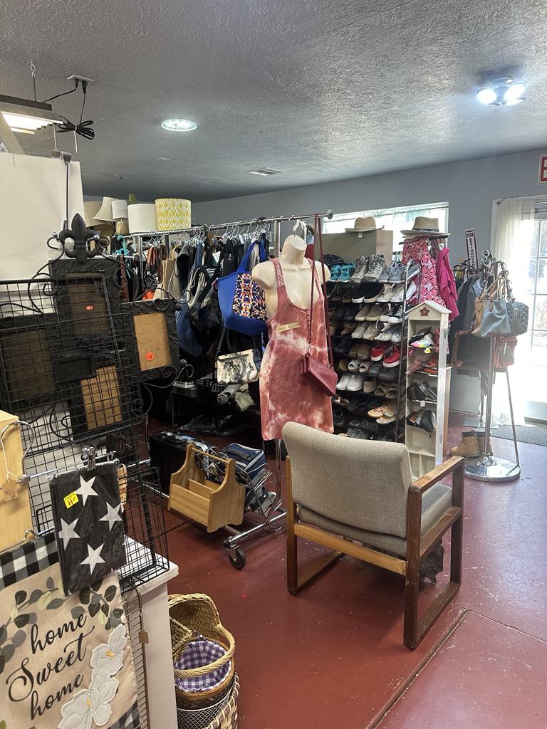 Clothing, shoes, furniture, and decor inside BAM Thrift store